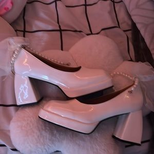 White chunky heels with bow and pearls